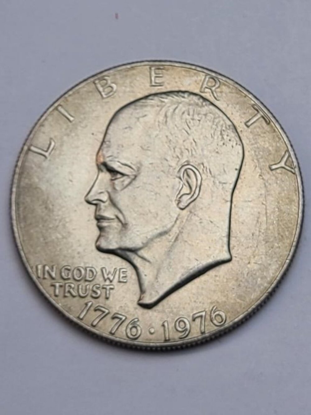 1976 Ike Bicentennial Dollar... Type 1... AU... Toning... In Protective Capsule